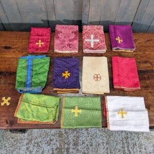 A colourful job lot of 11 silk and cotton chalice veils, religious textiles