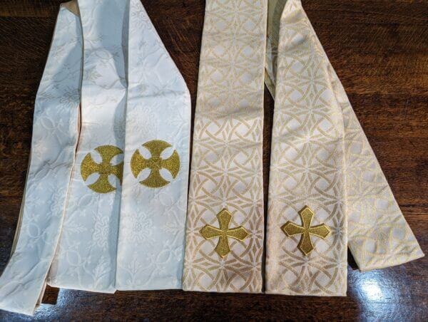 Two Church Stoles - one Cream & Gold with Crosses one nearly all Gold with Crosses