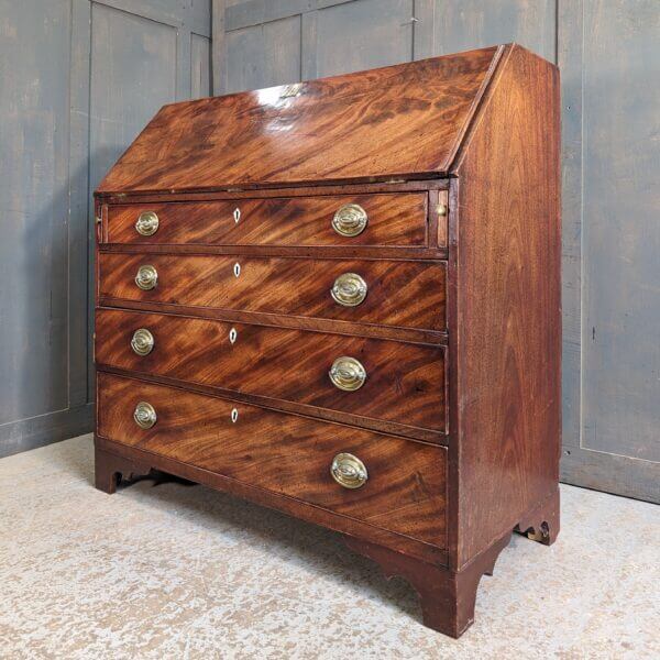 A Fine George III Mahogany Bureau With Original Brass Oval Handles