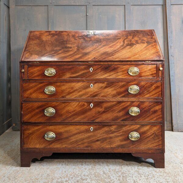 A Fine George III Mahogany Bureau With Original Brass Oval Handles