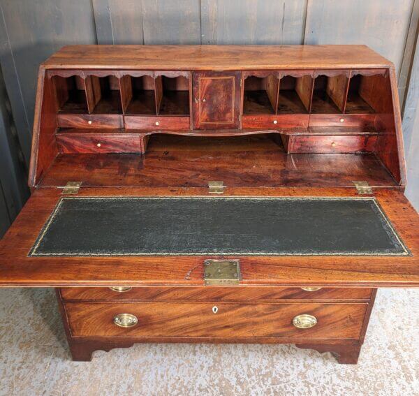 A Fine George III Mahogany Bureau With Original Brass Oval Handles