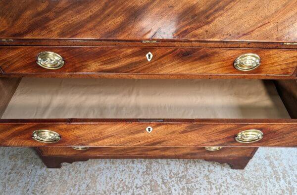 A Fine George III Mahogany Bureau With Original Brass Oval Handles