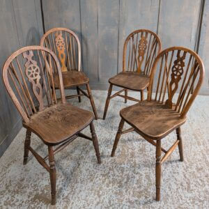 A Set of 4 Windsor Wheelback Elm and Beech Dining Chairs