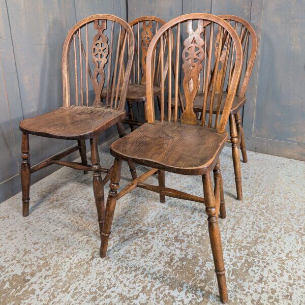 A Set of 4 Windsor Wheelback Elm and Beech Dining Chairs