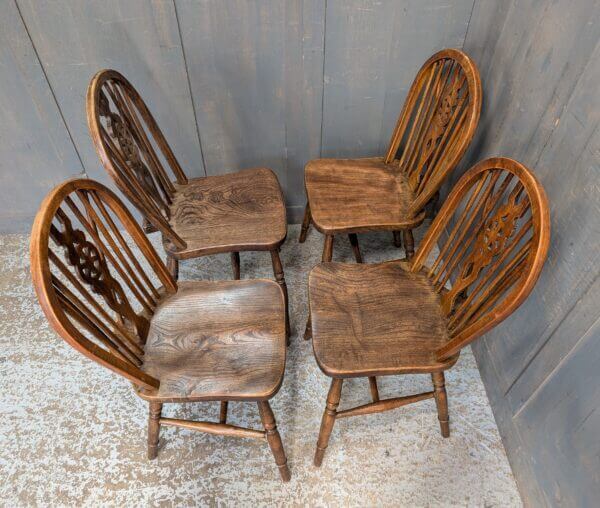 A Set of 4 Windsor Wheelback Elm and Beech Dining Chairs