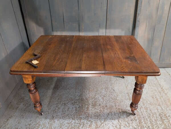 BARGAIN Oak Victorian Antique Wind Out Table with Fluted Legs & Winder