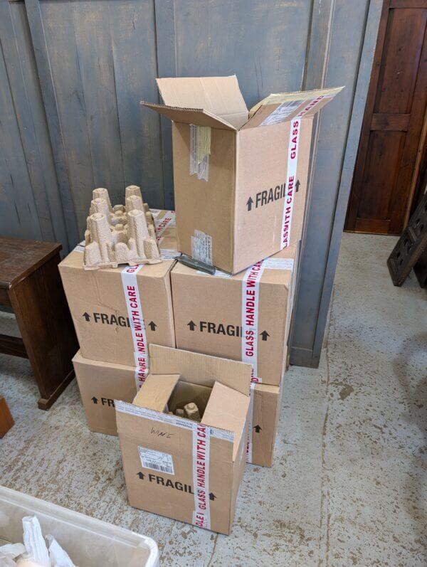 Bottles of Non-Alcoholic Communion Wine in Boxes