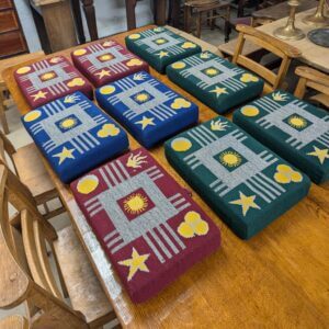 Colourful Collection of Nine Red, Blue and Green Church Kneelers Hassocks Cushions With Stars and Suns