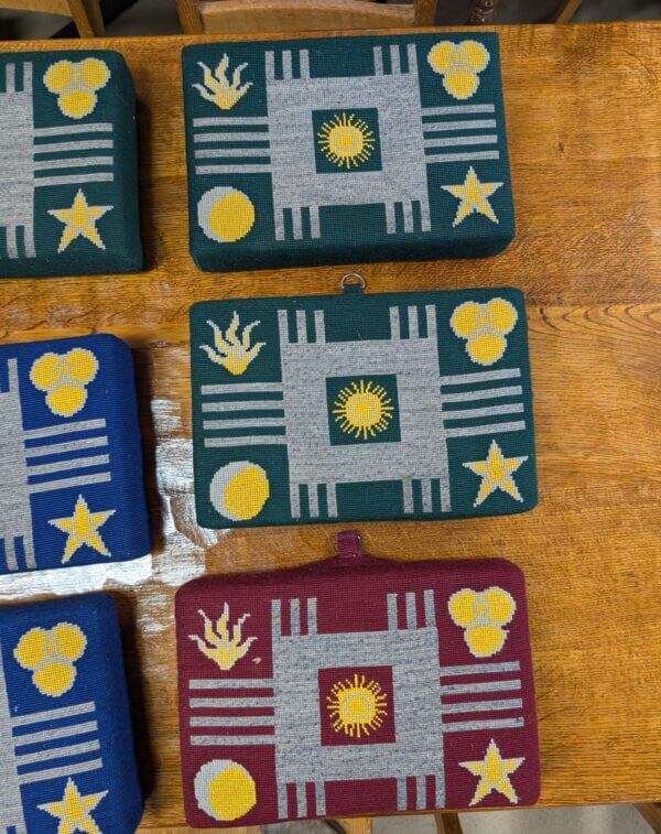 Colourful Collection of Nine Red, Blue and Green Church Kneelers Hassocks Cushions With Stars and Suns