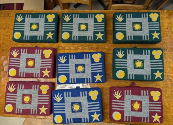 Colourful Collection of Nine Red, Blue and Green Church Kneelers Hassocks Cushions With Stars and Suns