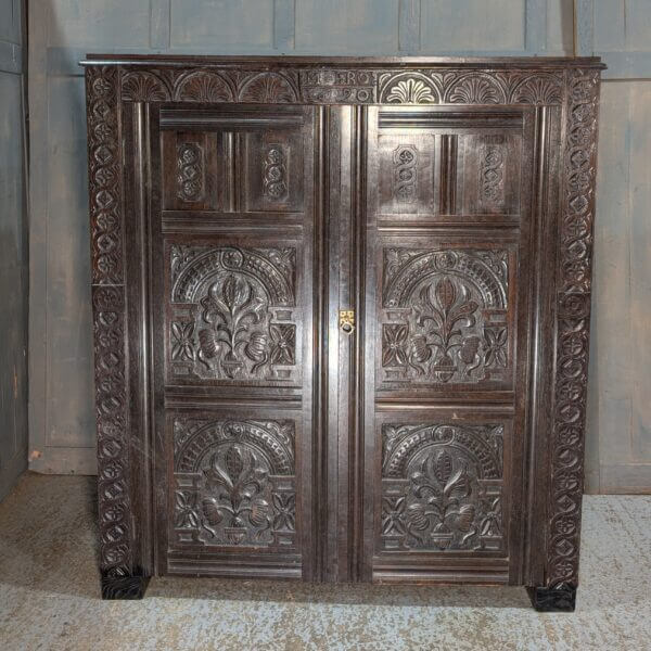 Tudor Style Carved Oak Housekeepers Cupboard Hanging Wardrobe