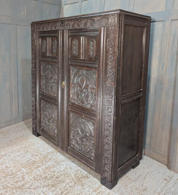 Tudor Style Carved Oak Housekeepers Cupboard Hanging Wardrobe