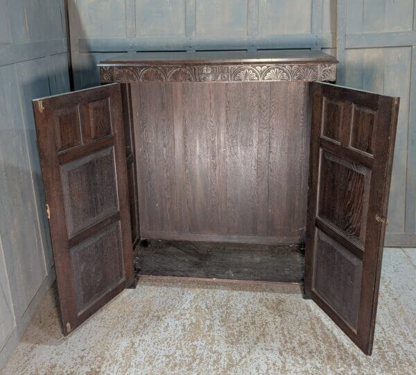 Tudor Style Carved Oak Housekeepers Cupboard Hanging Wardrobe