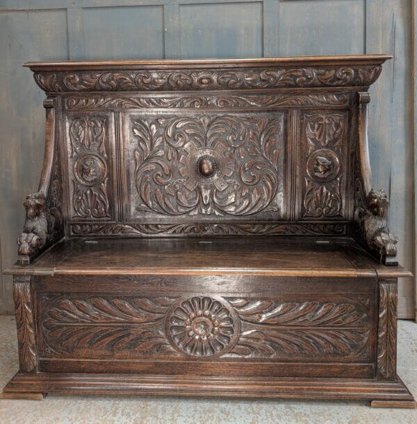 16th Century Style Highly Carved Oak Monks Bench with Romayne Heads