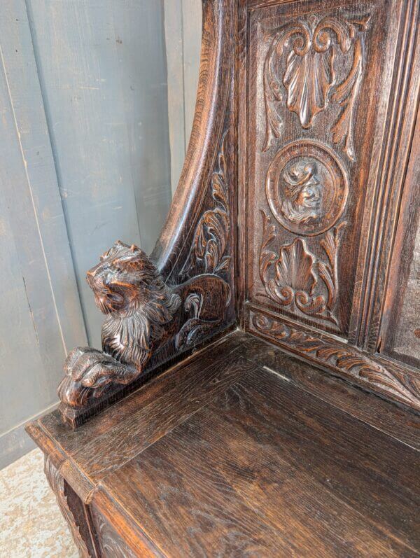 16th Century Style Highly Carved Oak Monks Bench with Romayne Heads