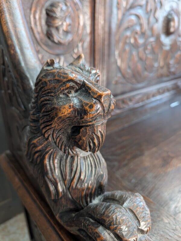 16th Century Style Highly Carved Oak Monks Bench with Romayne Heads