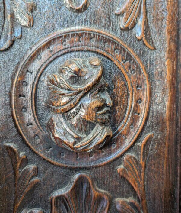 16th Century Style Highly Carved Oak Monks Bench with Romayne Heads