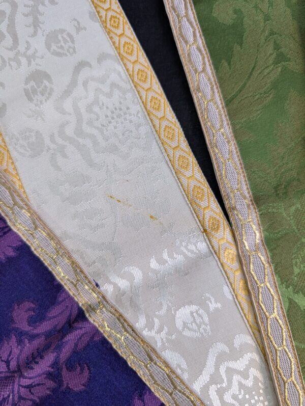Four Apparrelled Amices In Purple, White, Green and Red