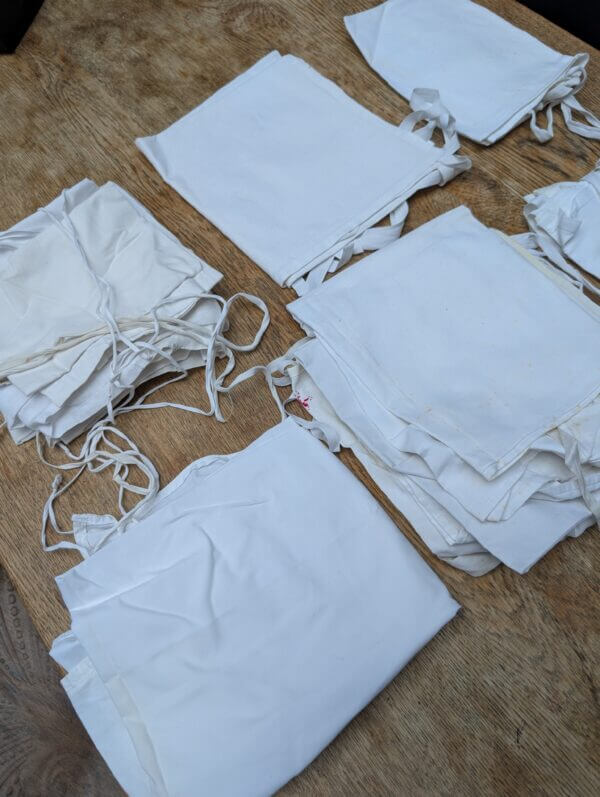 A Box of 11 Amices in Linen, Cotton and Fine Cotton