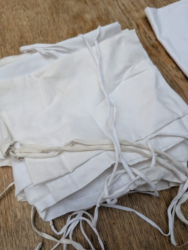 A Box of 11 Amices in Linen, Cotton and Fine Cotton