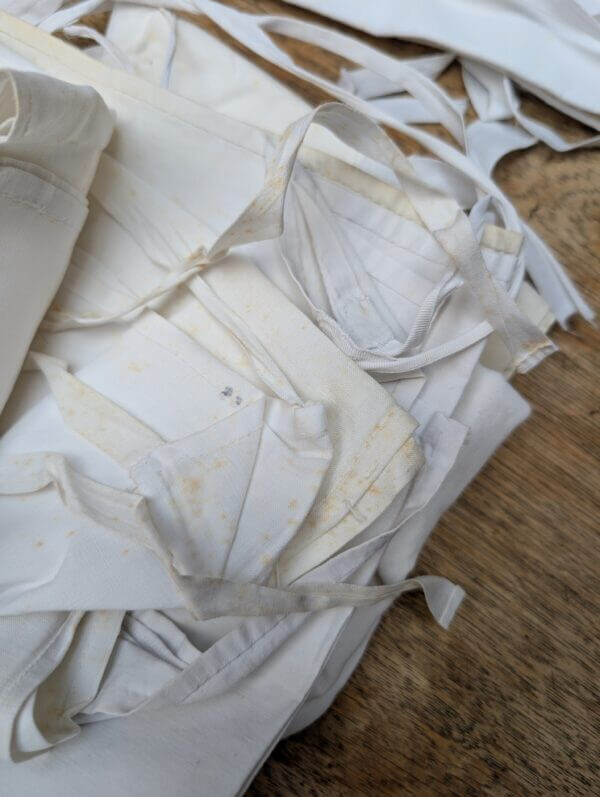 A Box of 11 Amices in Linen, Cotton and Fine Cotton