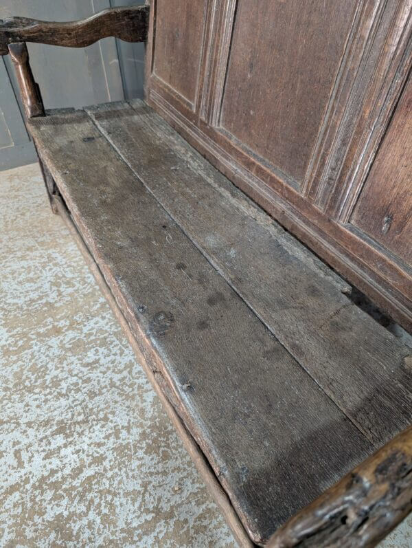 Early 17th Century Oak Panel Back Settle with Carving