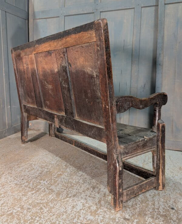 Early 17th Century Oak Panel Back Settle with Carving
