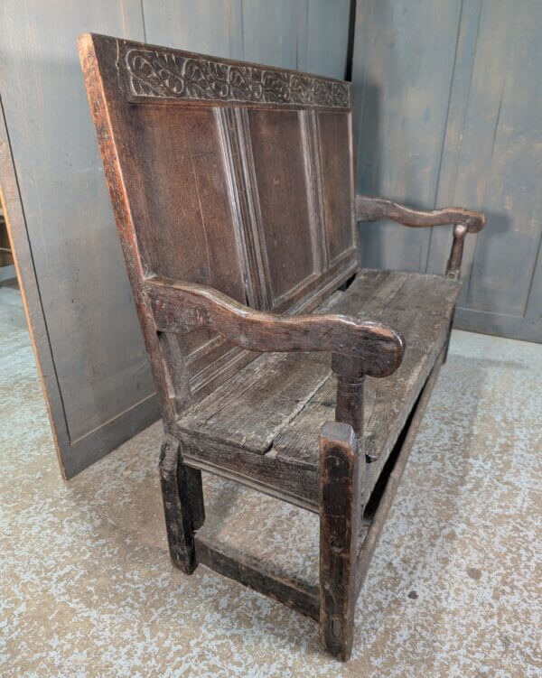 Early 17th Century Oak Panel Back Settle with Carving