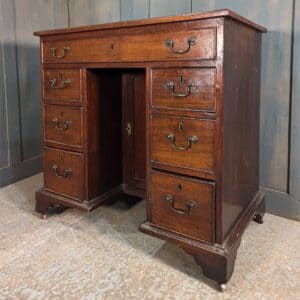 Very Small Georgian Mahogany Seven Drawer Kneehole Desk with Cupboard