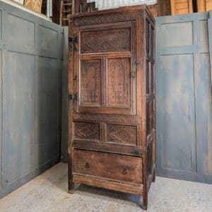 17th Century and Later Highly Carved Oak Cupboard with Drawer