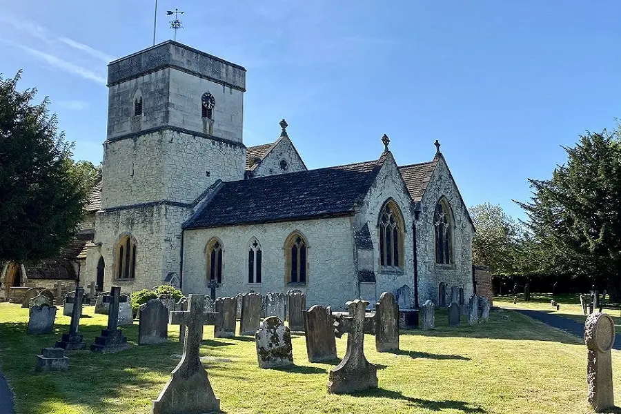 St Michael's Church in Betchworth, with its stone tower and churchyard